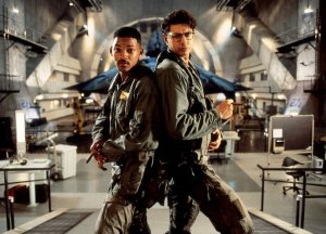 Will Smith and Jeff Goldblum back to back in front of an alien spaceship.