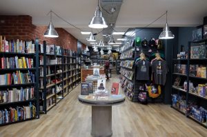 Interior of Travelling Man, York, lots of comic books on shelves and display tables.