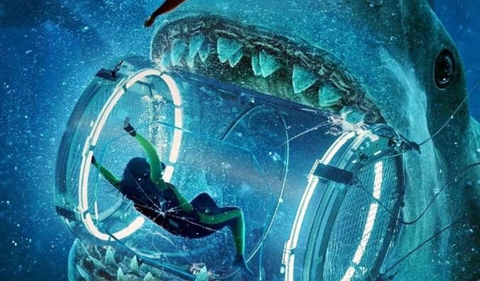 Image of diver inside a see-through shark tank, inside a giant shark's mouth, from the film The Meg